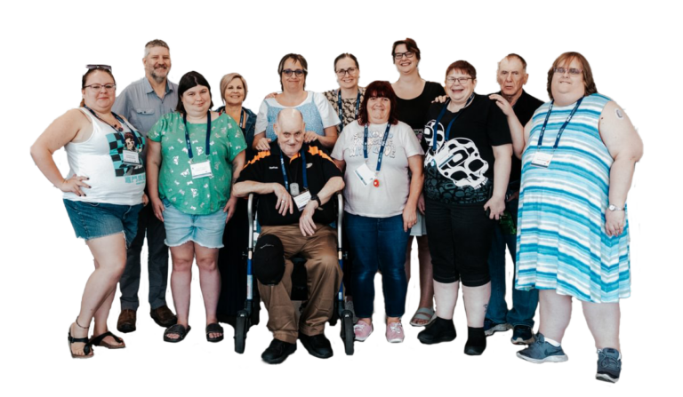 A group of people standing together smiling